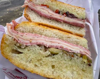 Central Grocery signature dishes Muffuletta Sandwich
Olive Salad
Beignets